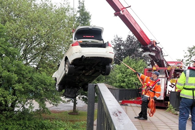 The BMW being removed from the canal