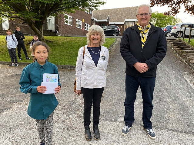 10-year-old logo winner Amelia Newbury of 40th Rochdale Scout Group with FOSAC chair Tricia Ayrton and Friends member Richard Lord