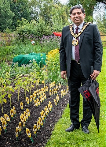 Mayor of Rochdale, Councillor Aasim Rashid at the sunflower collection station