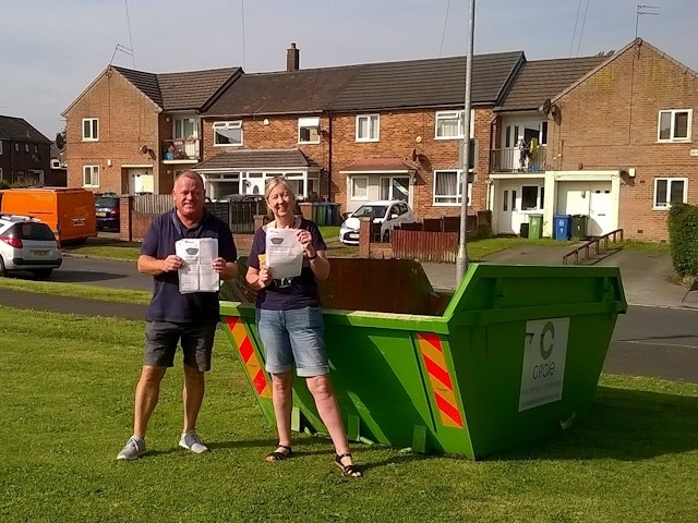 Cllr Phil Burke and Riverside housing officer Alison Roberts with one of the skips