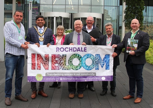 (L-R) Vice chair of Rochdale in Bloom Paul Ellison, Mayor of Rochdale Councillor Aasim Rashid, RHS judge Maxine Lord, Leader of Rochdale Council Neil Emmott, RHS judge Bernard Pendleton, Chairman of Rochdale in Bloom Roy Down and Councillor Phillip Massey, a member of the Rochdale in Bloom team