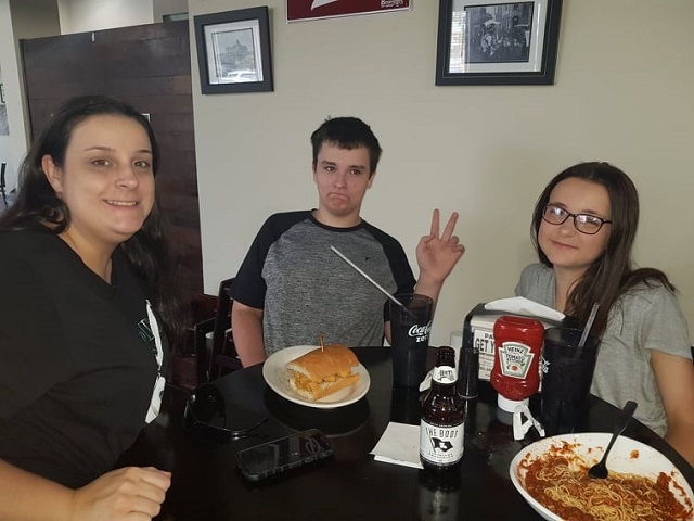 Craig Darce, centre, with two friends