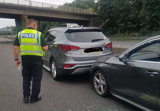 John brought the ill driver's car to a stop using his own car