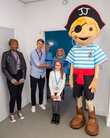 (L-R) Joyce Kapiamba (deputy MYP), Henry Leahy (MYP), Rachel and Anna (session facilitators at Jolly Josh), Erin Pollitt (deputy Children’s Champion) and the centre’s mascot, Jolly Josh