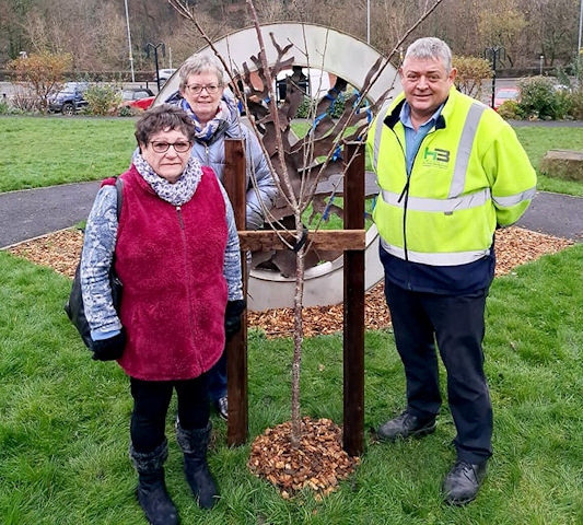 Chrissie Wolstenholme, President of the Norden WI; Rosemary Nunwick; and Michael Scott, H Bell and Sons