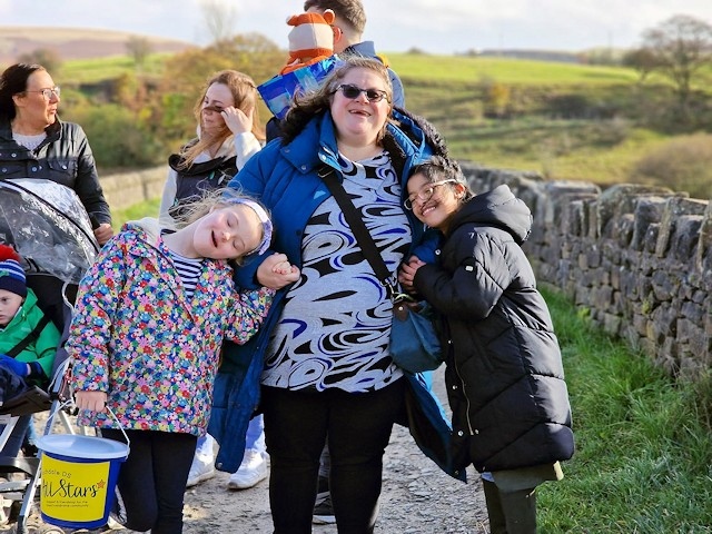 Rochdale DS All Stars chair Claire Minett with two of the younger members