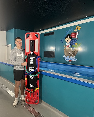 Jolly Josh Centre Lifeguard, Tom with donated board from Ferno