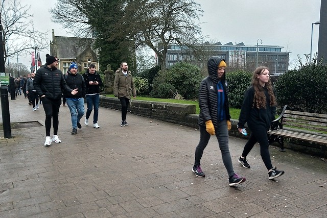 Football fans walk to Boundary Park, Oldham from the Crown Oil Arena