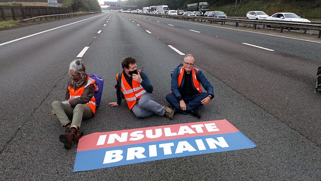 Rev Mark Coleman (right) during one of the Insulate Britain protests last September