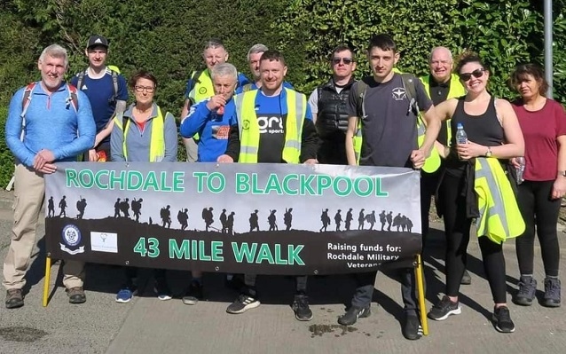 A team of 12 – comprised of Rochdale AFC Military Veterans, Their4U Fundraising and Dale In The Community Sports Trust – completed the feat between the Crown Oil Arena and Blackpool Tower after 17 hours