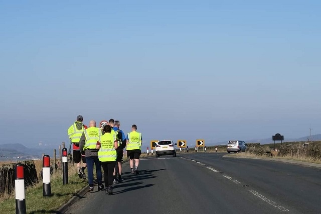 A team of 12 – comprised of Rochdale AFC Military Veterans, Their4U Fundraising and Dale In The Community Sports Trust – completed the feat between the Crown Oil Arena and Blackpool Tower after 17 hours