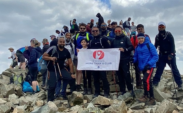 Zaara and her father, Doliz Miah, plus members of GMP and the Bangladeshi Arts and Sports Association, at the summit of Scafell Pike