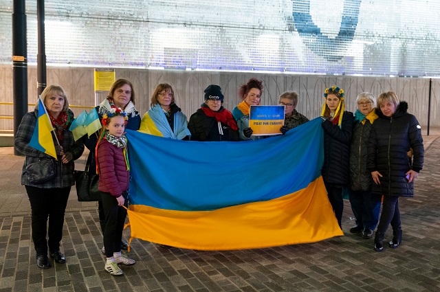 Members of Rochdale’s Ukrainian community at the Lviv bridge in the town centre last night