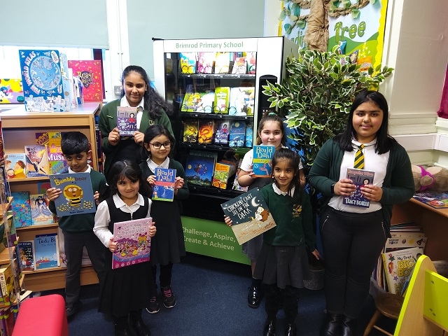 Pupils from Brimrod Primary School with books from the vending machine