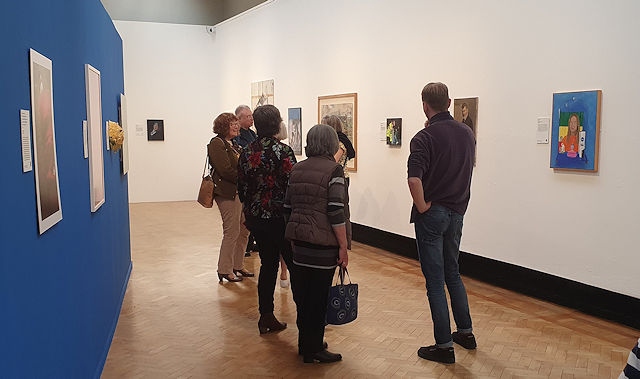 Assistant curator Bryan Beresford and Friends of Rochdale Art Gallery members