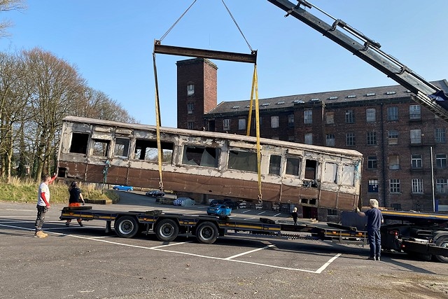 The carriage being loaded for transport to Bury