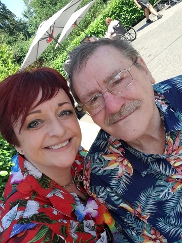 Kay Darlington, home manager of Springfield Park Care Home at the Hawaiian party, with a resident