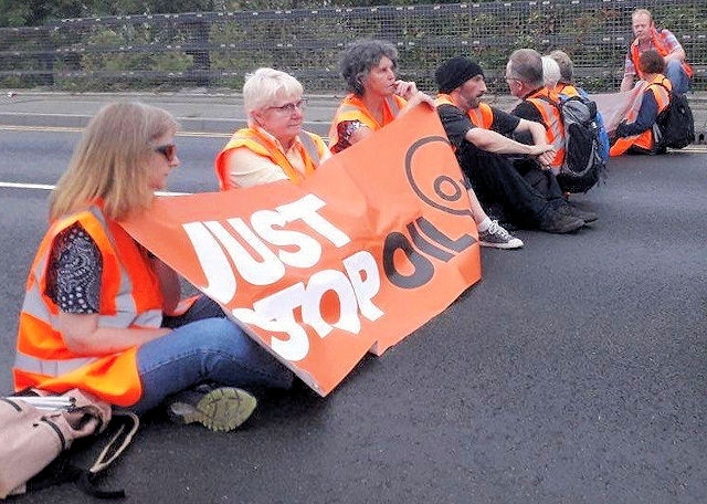 Just Stop Oil protest with Jane Touil (left), Wendy Cocks (second left) and Mark Coleman (fifth from left)