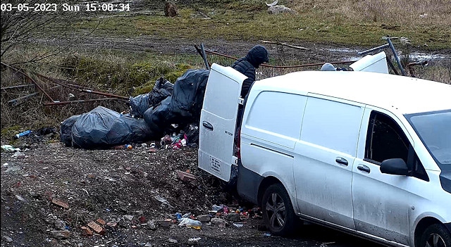 The men were caught dumping the bags from the back of the vehicle