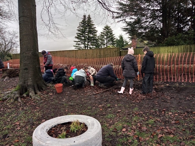 Planting a new hedge at Bamford Chapel & Norden United Reformed Church