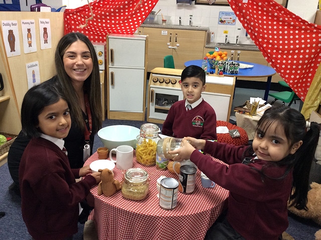 Danni Santana, EYFS lead with some of the children from Reception class