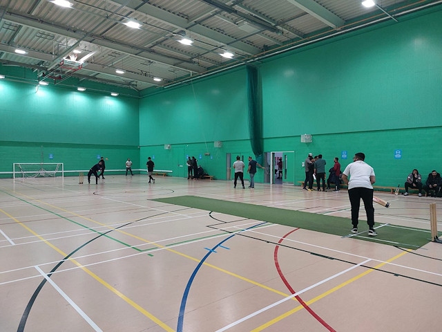 Players warming up ahead of a match in the Rochdale Indoor Cricket League