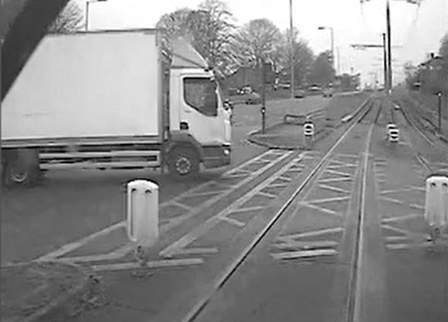 Footage from a tram showing a van crossing the tram tracks