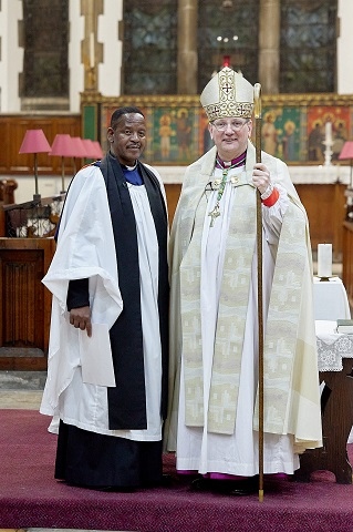 Reverend Sydwell Isaac with the Bishop of Middleton, Mark Davies