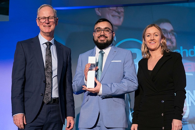 Learner of the year Hasnain Aslam was presented with his award by Emma Costello from Rochdale Training