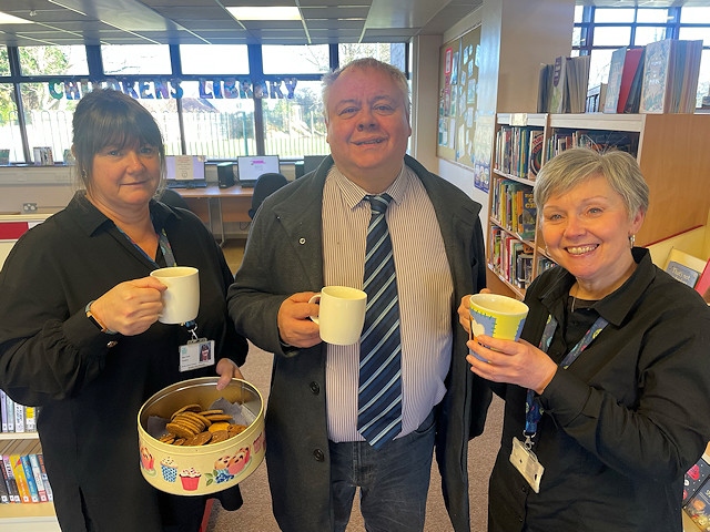 Rochdale Borough Council's cost of living support has included warm space venues. Council leader Neil Emmott is pictured at Alkrington Library