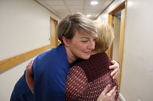 Dr Charlotte Barber hugging patient