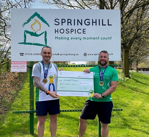 Carl Bennion and Chris Elliott with the cheque for Springhill