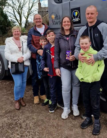 Steven, wife Tracy, daughter Lisa, son in law Simon and his three grandchildren alongside his cab