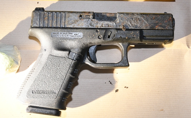 Two pistols and a Glock 19 with ammunition were located wrapped in black bin bags