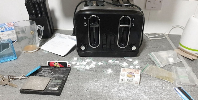 Officers conducted a search of the property and seized thousands of pounds of cash, Class A drugs, drugs paraphernalia such as scales with residue on, suspected to be cocaine, unused snap bags, and multiple mobile phones – all consistent with a drugs operation