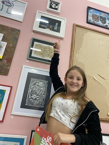 Daisy Coulter with her artwork in London ('Oh Baby!' is the very top piece)