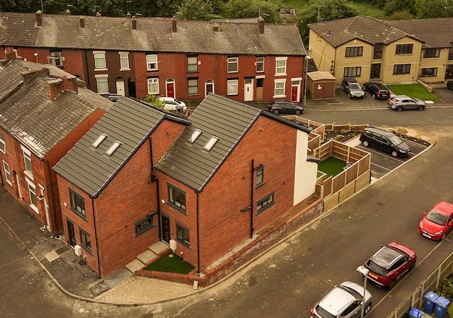 Designed by PHA Architects and built by Deji Properties Ltd., the development has added two three-bedroom houses next to houses on Larkhill Court