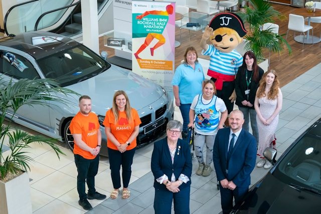 Left to right: Tom Hall and Laura Tomlinson from Maggie’s; Sarah Ford and Jaime Foster, Jolly Josh, the Jolly Josh mascot; Vicki Barnett, Jenna Kavanagh from Springhill Hospice with Councillor Janet Emsley, cabinet member for equity, safety and reform with Scott Cunningham, head of business at Williams Rochdale BMW