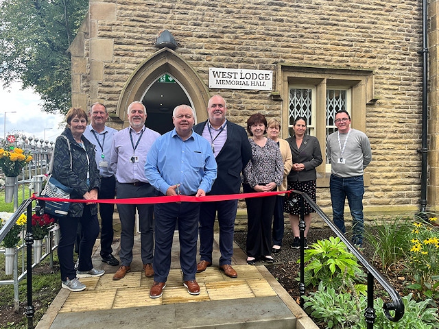 Angela Smith, Alan Webster, Graeme Douglas, Neil Emmott, Martin Taylor, Carol Edgar, Sue Cliffe, Carol Albison and Stephen Anstee attend the official opening of West Lodge Memorial Hall at Rochdale Cemetery