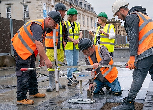 One of the decorative stones is laid in Town Hall Square