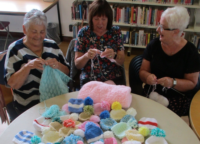 Sheila, Janet & Christine busily knitting hats for premature babies