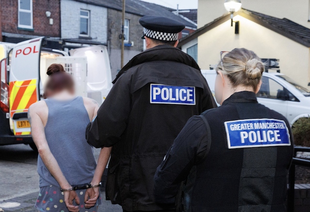 Officers along with the RSPCA rescued 14 puppies and arrested four people during a series of raids in Rochdale and Manchester