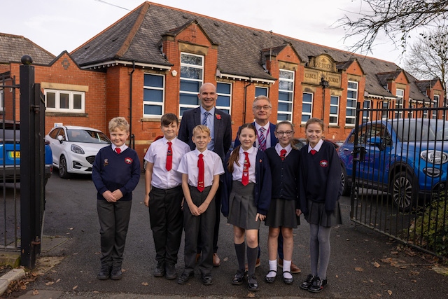 Heap Bridge Headteacher, Mr Marcus Cockcroft, Hollingworth Learning Trust CEO, Mr Darren Randle, and the 2024-2025 pupil leadership team at Heap Bridge.