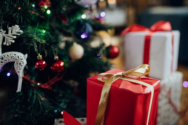 Christmas presents under a Christmas tree