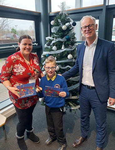 Chief executive Steve Rumbelow meets Christian Kilduff at Newlands School alongside his mum, Diana