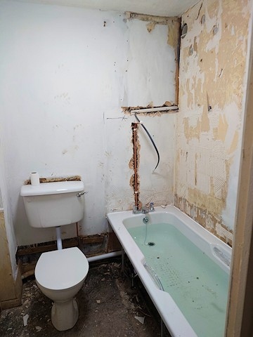 Work underway to replace the shower in the home of an RBH tenant living on the Freehold estate in Rochdale