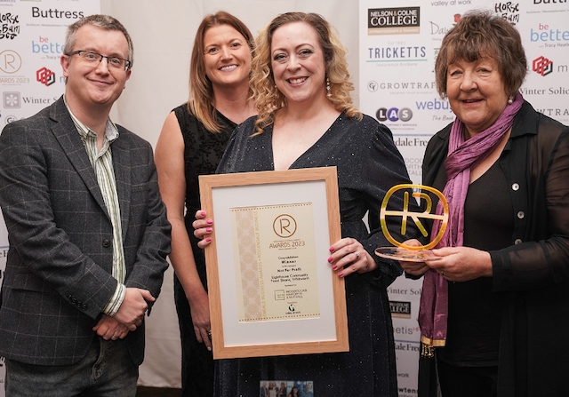 David Buskey from sponsor Woodcocks Haworth & Nuttall presents the Rossendale Business Awards Not for Profit trophy to Lindsay Parker, Naomi Burke and Marilyn Jones 