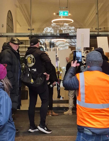 Protestors outside Andy Burnham's office in Manchester. Photo: John Lawrence