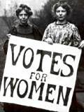 Emily Pankhurst with Votes for Women poster