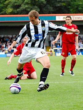 Glenn Murray takes a first half shot for Dale